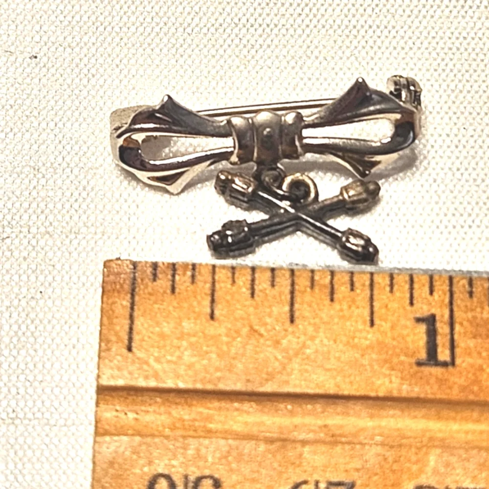 Vintage Silver-Tone Bow Pin with Crossed Batons Charm